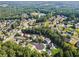 Aerial view of the community showcasing neighborhood homes surrounded by mature trees in a lovely setting at 1343 Cartwright Ln, Lawrenceville, GA 30045