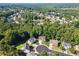 Aerial view of the community shows the neighborhood homes surrounded by mature trees in a cul-de-sac at 1343 Cartwright Ln, Lawrenceville, GA 30045