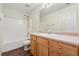 A bathroom featuring a single sink vanity and tub with shower at 1343 Cartwright Ln, Lawrenceville, GA 30045