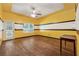 Bedroom featuring wood look flooring, a ceiling fan, and a door to the exterior at 1343 Cartwright Ln, Lawrenceville, GA 30045