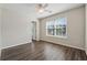 Bright bedroom with neutral walls, wood-look floors, and large window at 1343 Cartwright Ln, Lawrenceville, GA 30045