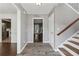 Inviting foyer with wood-look flooring and view of staircase and living area at 1343 Cartwright Ln, Lawrenceville, GA 30045