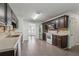 Kitchen features stainless steel appliances, tile floors, and adjacent dining area at 1343 Cartwright Ln, Lawrenceville, GA 30045