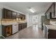 Kitchen features stainless steel appliances, tile floors, and adjacent dining area at 1343 Cartwright Ln, Lawrenceville, GA 30045