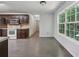 Kitchen features stainless steel appliances, tile floors, and adjacent dining area at 1343 Cartwright Ln, Lawrenceville, GA 30045