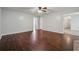 Spacious living room features hardwood floors and a ceiling fan for added comfort at 1343 Cartwright Ln, Lawrenceville, GA 30045