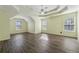 Spacious main bedroom with tray ceiling and stylish flooring at 1343 Cartwright Ln, Lawrenceville, GA 30045