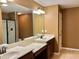 Bathroom features a double sink vanity, granite countertops, and updated fixtures at 1854 Caswell # 56, Marietta, GA 30060