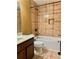 Bathroom features a tub-shower combination, tile surround, and dark cabinets at 1854 Caswell # 56, Marietta, GA 30060