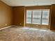 Bright bedroom featuring neutral walls, carpet, and natural light from three large windows at 1854 Caswell # 56, Marietta, GA 30060