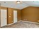 Bedroom with neutral walls and carpet and two white interior doors at 1854 Caswell # 56, Marietta, GA 30060