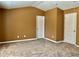 Bedroom with neutral walls and carpet and two white interior doors at 1854 Caswell # 56, Marietta, GA 30060