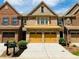 Charming townhome with brick facade, two-car garage, and well-maintained front yard at 1854 Caswell # 56, Marietta, GA 30060