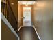 Entryway featuring a white door, tile flooring and staircase with dark wood trim at 1854 Caswell # 56, Marietta, GA 30060