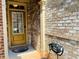 Close-up of the front door of a brick house with beige trim and house number 1854 at 1854 Caswell # 56, Marietta, GA 30060