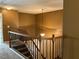 Upstairs hallway with carpet and a wooden railing surrounding the stairs at 1854 Caswell # 56, Marietta, GA 30060
