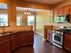 Modern kitchen with granite countertops, stainless steel appliances, and cherry wood cabinets at 1854 Caswell # 56, Marietta, GA 30060