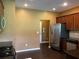 A functional kitchen featuring stainless steel appliances, dark countertops, and wood cabinets at 1854 Caswell # 56, Marietta, GA 30060