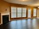 Spacious living room with fireplace, hardwood floors, and large windows at 1854 Caswell # 56, Marietta, GA 30060