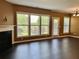 Bright living room with fireplace and large windows showcasing the outdoor deck at 1854 Caswell # 56, Marietta, GA 30060