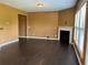Open living room with fireplace, dark hardwood floors, and lots of natural light at 1854 Caswell # 56, Marietta, GA 30060