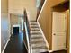 View of a carpeted staircase with dark wood floors and trim, leading to the second floor at 1854 Caswell # 56, Marietta, GA 30060