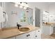 Well lit bathroom with double sinks, custom cabinets and a large mirror at 1805 Wilkenson Xing, Marietta, GA 30066
