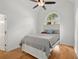 Bedroom features hardwood floors, a ceiling fan and a large window at 1805 Wilkenson Xing, Marietta, GA 30066