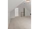 Bonus room features neutral carpet, recessed lighting, and access to other rooms in the home at 1805 Wilkenson Xing, Marietta, GA 30066