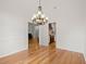 Bright dining room with hardwood floors and an ornate chandelier at 1805 Wilkenson Xing, Marietta, GA 30066