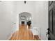 Bright foyer with hardwood floors, white walls, and an arched doorway leading to the living area at 1805 Wilkenson Xing, Marietta, GA 30066