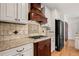 Gourmet kitchen with stainless steel appliances, granite countertops, and custom cabinetry at 1805 Wilkenson Xing, Marietta, GA 30066