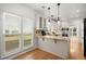Bright and airy kitchen featuring granite countertops, stainless steel appliances, and plenty of natural light at 1805 Wilkenson Xing, Marietta, GA 30066