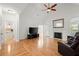 Spacious living room with hardwood floors, high ceilings, a fireplace, and an open layout at 1805 Wilkenson Xing, Marietta, GA 30066