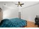 Spacious main bedroom features hardwood floors, ceiling fan and a tray ceiling at 1805 Wilkenson Xing, Marietta, GA 30066
