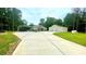 Well-maintained home with a carport and large garage, surrounded by a green lawn and trees at 7460 Highway 101, Rockmart, GA 30153