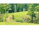 This property features deer, a picturesque pavilion, and a lush green lawn with landscaping at 7460 Highway 101, Rockmart, GA 30153
