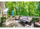 Outdoor deck featuring comfortable seating, an umbrella, and lush views of the surrounding landscape at 1024 Brownstone Dr # 2, Marietta, GA 30008