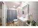 Well-lit bathroom features a modern vanity, neutral colors and practical updates at 1024 Brownstone Dr # 2, Marietta, GA 30008