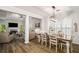 Bright dining room flows to living room and features modern lighting, shutters and wood floors at 1024 Brownstone Dr # 2, Marietta, GA 30008