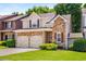 Charming two-story home with stone accents, double garage, manicured lawn and mature landscaping at 1024 Brownstone Dr # 2, Marietta, GA 30008