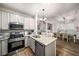 Spacious kitchen with stainless appliances, granite countertops, and a view to the dining area at 1024 Brownstone Dr # 2, Marietta, GA 30008