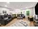 Relaxing living room with a large sectional, sliding barn door and many windows at 1024 Brownstone Dr # 2, Marietta, GA 30008