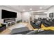 Spacious living room with fireplace, large screen tv, and sectional seating, perfect for entertaining or relaxing at 1024 Brownstone Dr # 2, Marietta, GA 30008