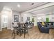 Spacious living room with wood floors, modern lighting and ample seating at 1024 Brownstone Dr # 2, Marietta, GA 30008