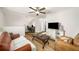 Cozy loft featuring a home office, hardwood flooring, TV, and comfortable furnishings at 1024 Brownstone Dr # 2, Marietta, GA 30008
