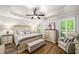 Cozy bedroom boasts trey ceiling, plantation shutters and a beautiful, neutral color palette at 1024 Brownstone Dr # 2, Marietta, GA 30008