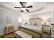 Bedroom features a tray ceiling, light wood floors, plantation shutters, and neutral décor at 1024 Brownstone Dr # 2, Marietta, GA 30008