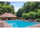 Community pool features a large swimming pool with deck chairs for relaxation at 1024 Brownstone Dr # 2, Marietta, GA 30008