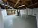 Bright, unfinished basement with painted floor, exposed beams and ductwork at 25 Gladstone Sw Dr, Marietta, GA 30060